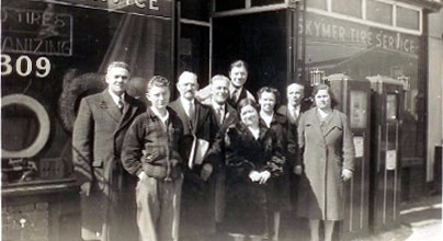 The Skymer Family and friends in front of Skymer Tire Service, 1309 Broadway