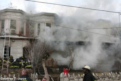 Smoke obscures the view of 935, 937, and 939 Vine Street