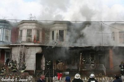 Smoke obscures the view of 937 Vine Street