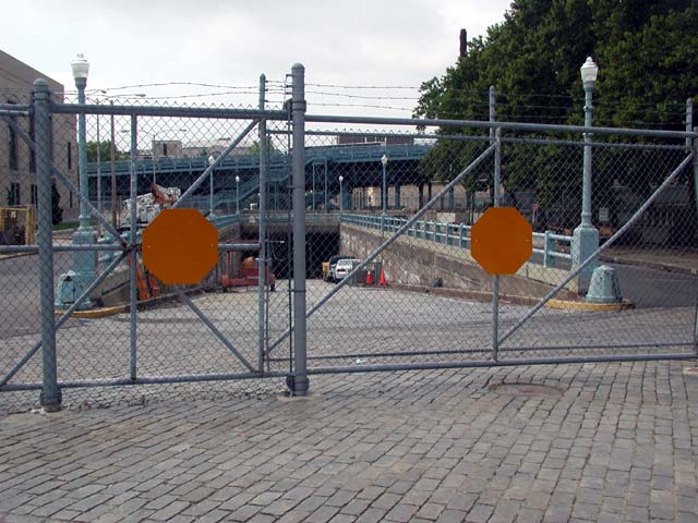 4th Street tunnel under the Ben Franklin Bridge, looking south, July 5, 2004. Note the cobblestone paving and stairway leading up to the pedestrian walkway on the bridge.