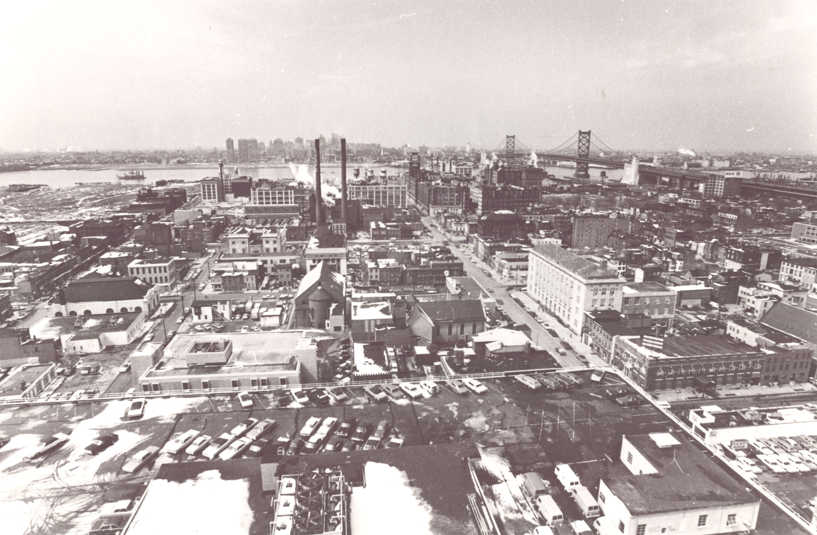 1970 aerial view looking down Market Street from City Hall — Parkade Building with cars on roof in foreground