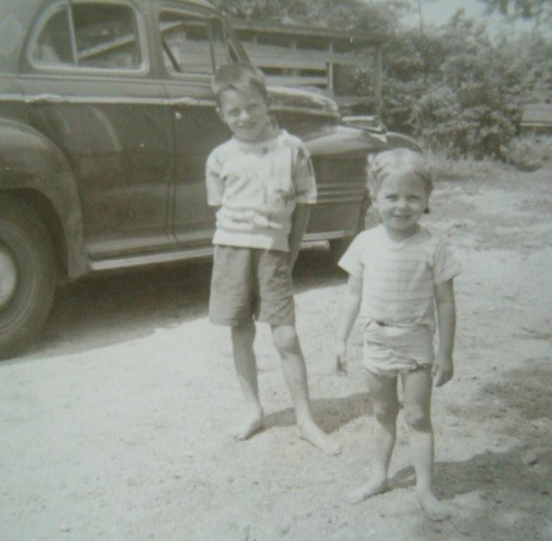 Joe Seddon Jr. and baby sister Marilynne near the street vendor's shed