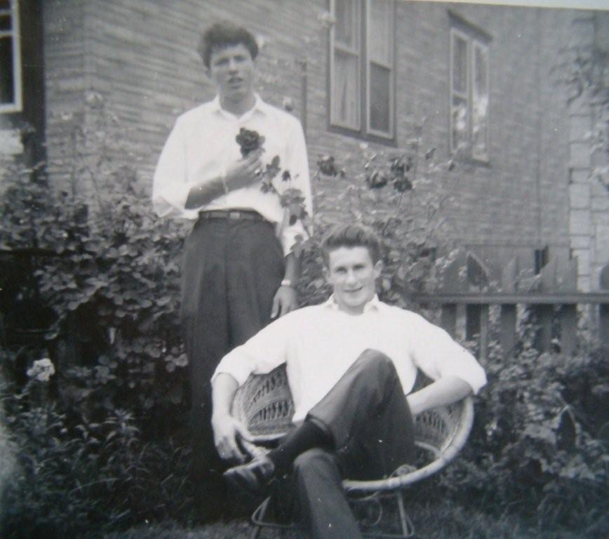 Joe Seddon standing with Mark Hutchinson seated, aunt Madge Hickey's yard on Polk Avenue, 1959 or 1960