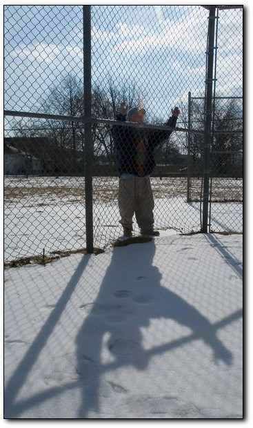 Pete Perez, president of the Cramer Hill Little League, looks over one of the league's fields