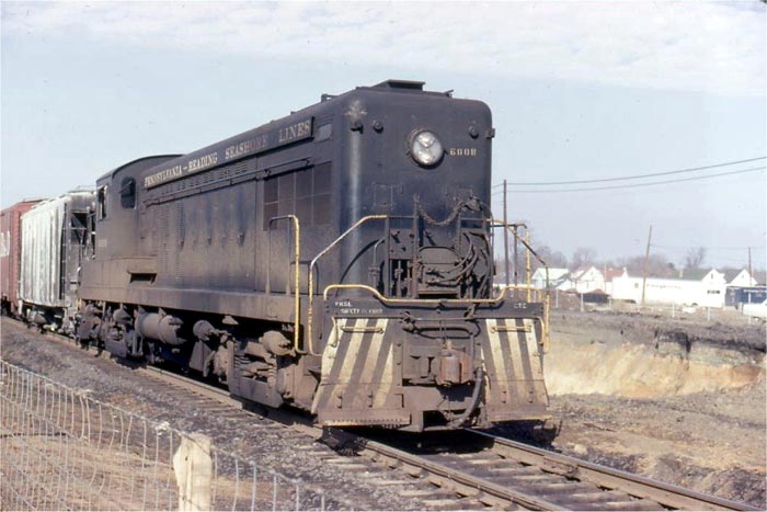 Pennsylvania Reading & Seashore Line diesel pulling freight through Haddonfield, with construction for the high speed line extension visible