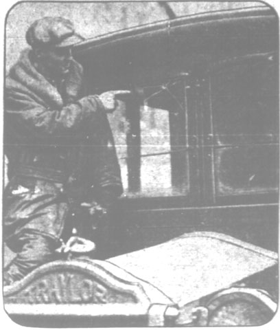 George Murphy showing hole in truck windshield, Camden Courier-Post February 11, 1928