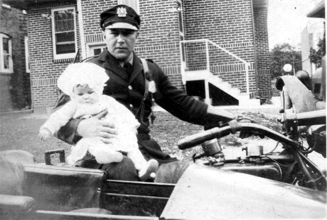 Officer John Stanton with his daughter Eleanor on Mickle Street in East Camden, 1927