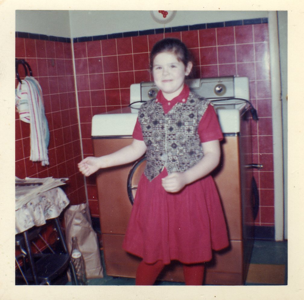 Linda Becoskie in front of new washing machine. No more walks to the coin operated laundry on 8th & Linden Streets.