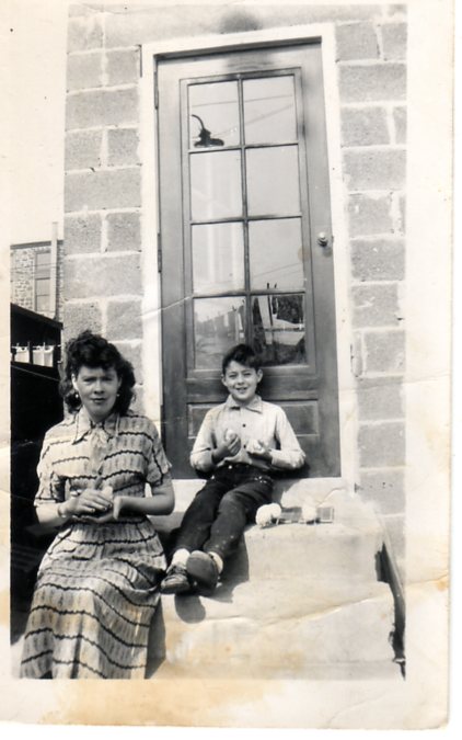 Mary and Raymond Becoskie in backyard of 510 North 7th Street with Easter chicks