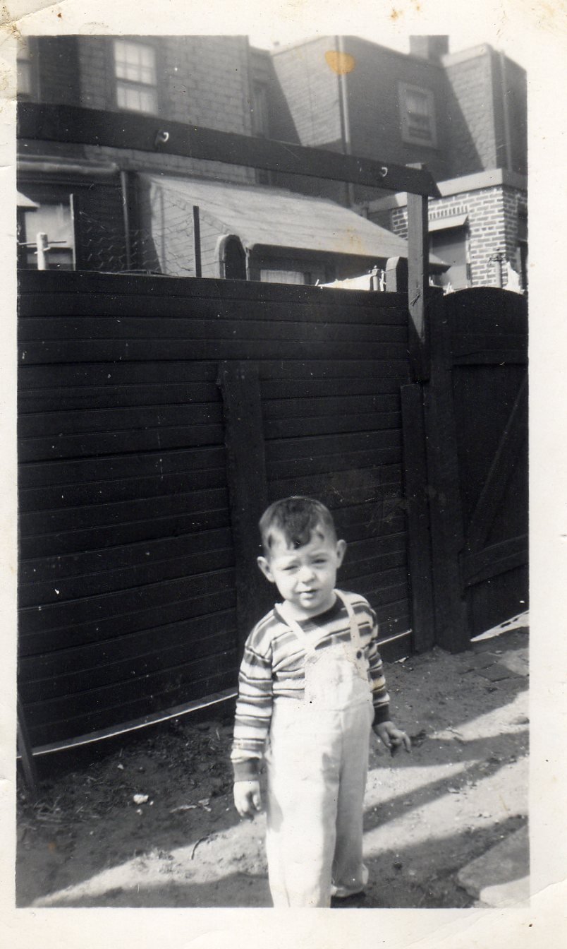 Michael Becoskie in the backyard of 510 North 7th Street. At southwest, the rear of Buckley's barbershop.