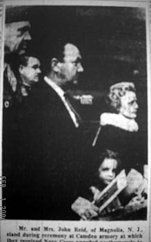 Mr. and Mrs. John Reid receive the Navy Cross awarded posthumously to their son, Marine Cpl. John M. Reid, at ceremony at Camden armory