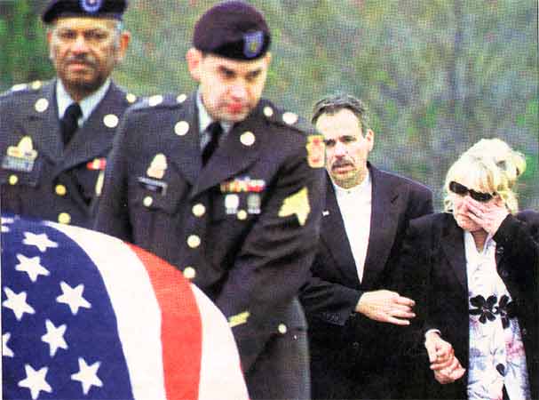 Stephen and Rosemarie Froehlich walk behind their son's flag draped casket, Camden Courier-Post, April 4, 2004