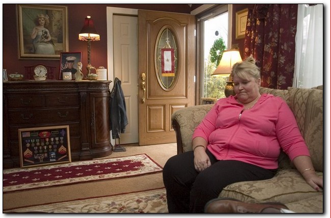 AVI STEINHARDT/Courier-Post. 'There are days when you want to fall to pieces, but you hold it together,' says Linda Ryan, whose Marine son was killed in Iraq.