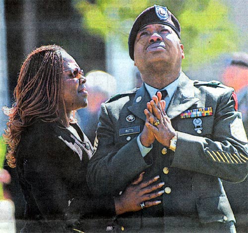 Army Staff Sergeant Ronnie Butts comforted at Sgt. First Class Michael Egan's burial in Cherry Hill