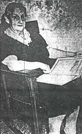 Mrs. Margaret Steigerwald with family book — Camden Courier-Post December 5, 1942