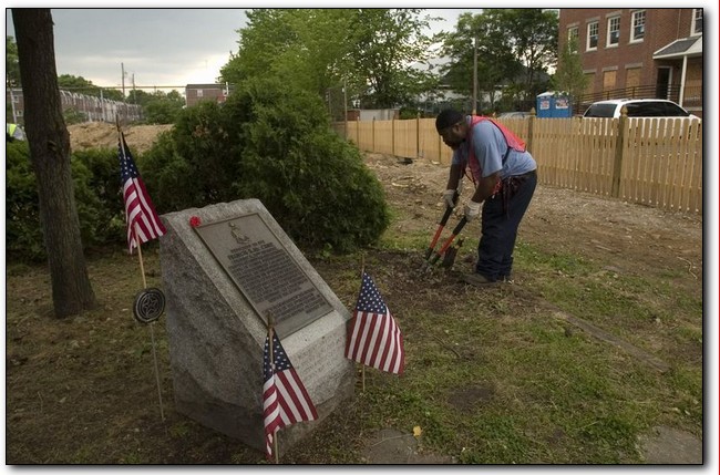 Camden public works worker Rodney Wearing trims shrubs around the Francis X. McGraw monument on New Jersey Road, June 2007