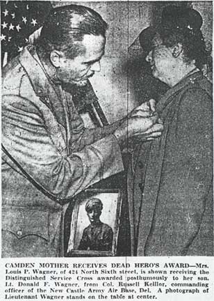 Mrs. Louis P. Wagner receives the Distinguished Service Cross from Col. Russell Keillor at New Castle Army Air Base, September 25, 1945