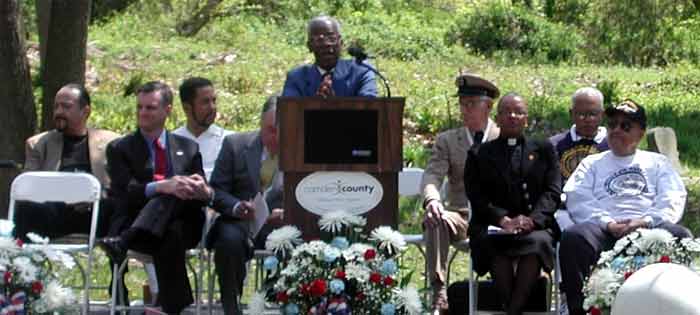 Bryson Armstead at podium; from left: State Senator Wayne Bryant, Congressman Rob Andrews, James Beach, Chief Petty Officer George Martella USN ret., Reverend Renee McCleary, Frederick Pierce, Roland Wilson