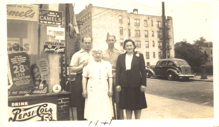 Harold Casden, Jennie Cohen, Sidney Cohen, and Ethel Lefkow Cohen outside candy store on Allerton Ave, Bronx NY, between 1939 and 1942