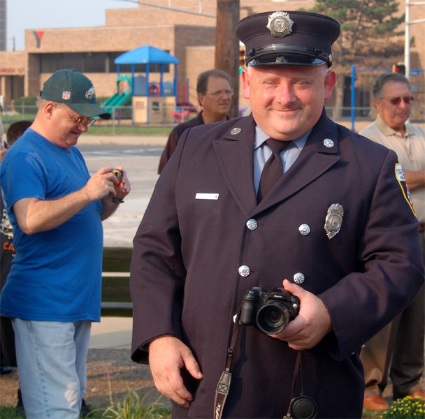 Edward Glaze Jr. and Edward Glaze III with cameras, Camden Firemen's Memorial Dedication, 2006