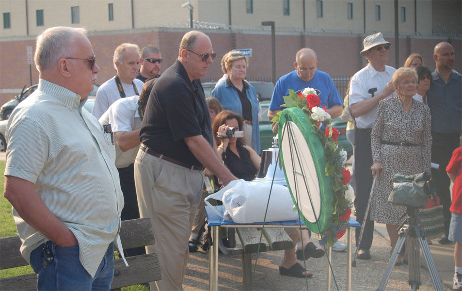 Lee Ryan wearing black shirt tolls the bell for each of the Fallen, Camden Firemen's Memorial Dedication, 2006