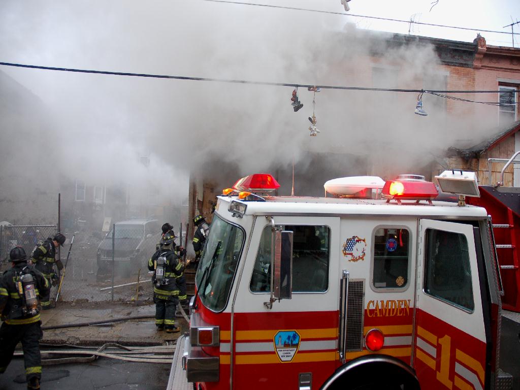 Fire fighters force their way through heavy smoke to attack the blaze, Bailey Street, December 13, 2007