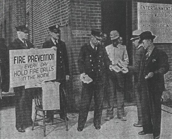 Members of Engine Company No. 8 distributing fire prevention pamphlets on Broadway, October 1936