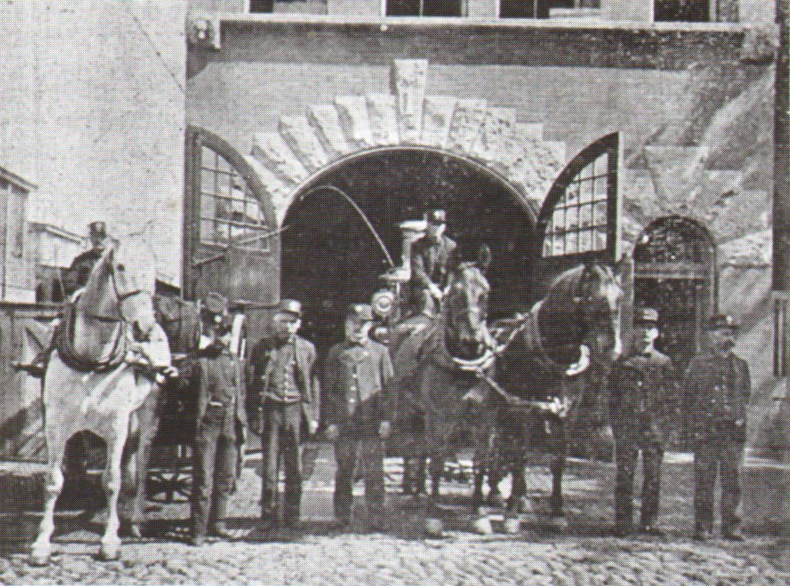 Engine Company 1 with its second class Amoskeag steamer rebuilt by LaFrance Engine Works, and two-wheeled Silsby hose cart, 409 Pine Street, 1896