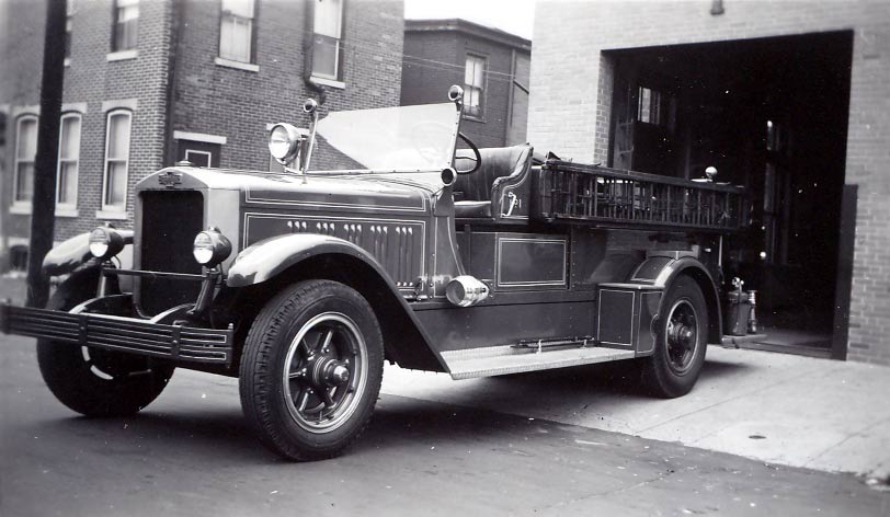 Engine Company 1, 1934 American LaFrance Pumper 1000 GPM, front of building and garage door remodeled, 409 Pine Street, June 1952