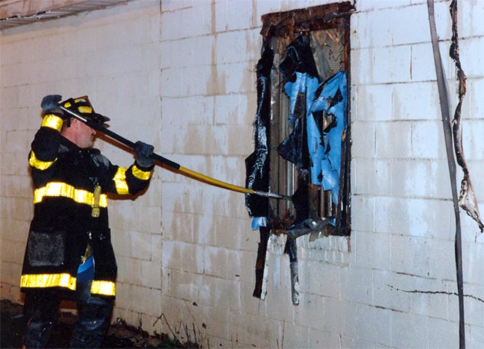 Rescue Company 1 at work, bowling alley fire, 2600 Mount Ephraim Avenue, April 10, 1993. Joel Bain in the foreground.