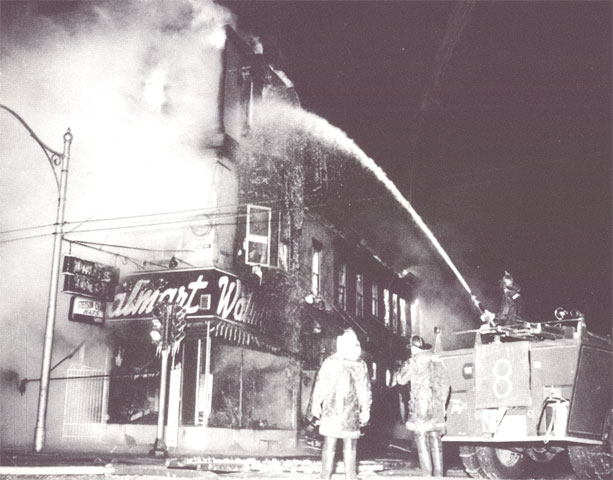 Engine Company 8 operates master stream at Walmart fire, Broadway and Chestnut Streets, January 14, 1964