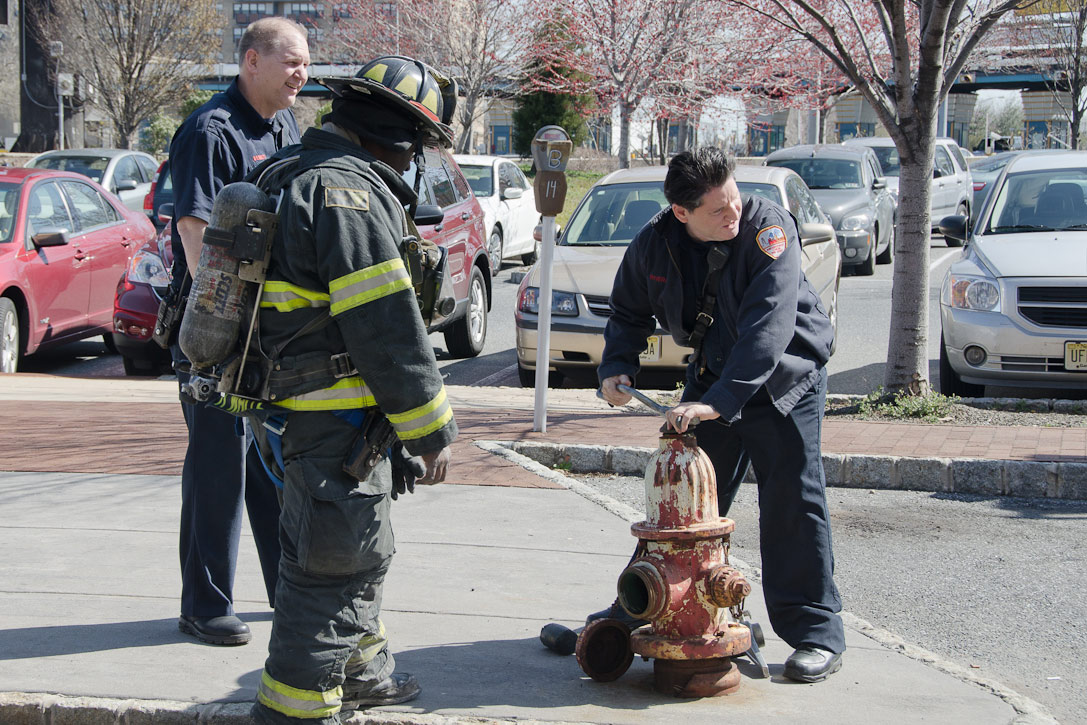 Howard Bennett, Ken White, and Gabe Rivera at a hydrant on Rutgers Street, March 14, 2012