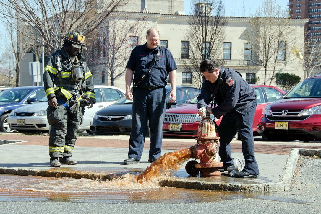 Ken White, Howard Bennett, and Gabe Rivera at a hydrant on Rutgers Street, March 14, 2012