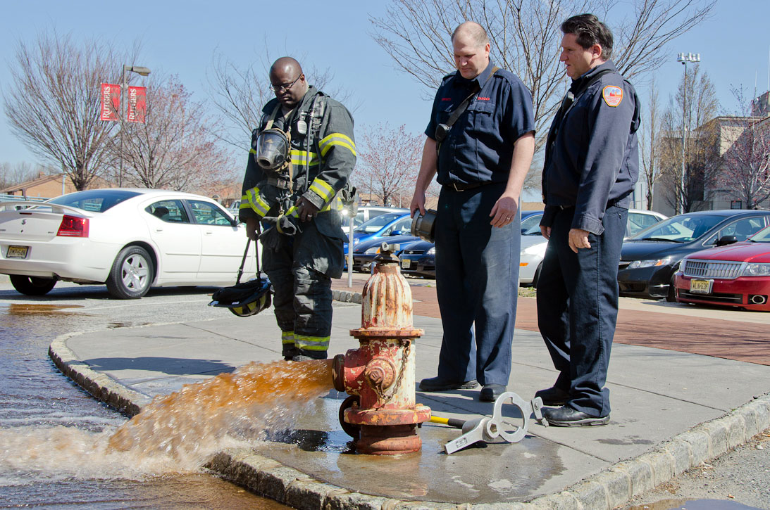 Ken White, Howard Bennett, and Gabe Rivera at a hydrant on Rutgers Street, March 14, 2012