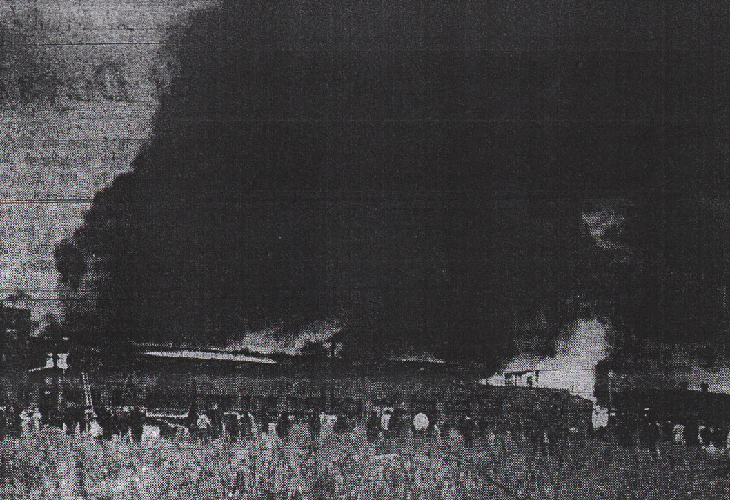Dense smoke billows from former John R. Evans Company leather tanning plant in North Camden