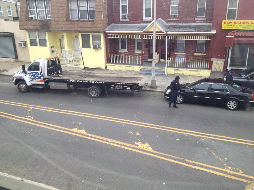 View from second floor of Squad Company 7 — Cadillac being towed, February 22, 2013