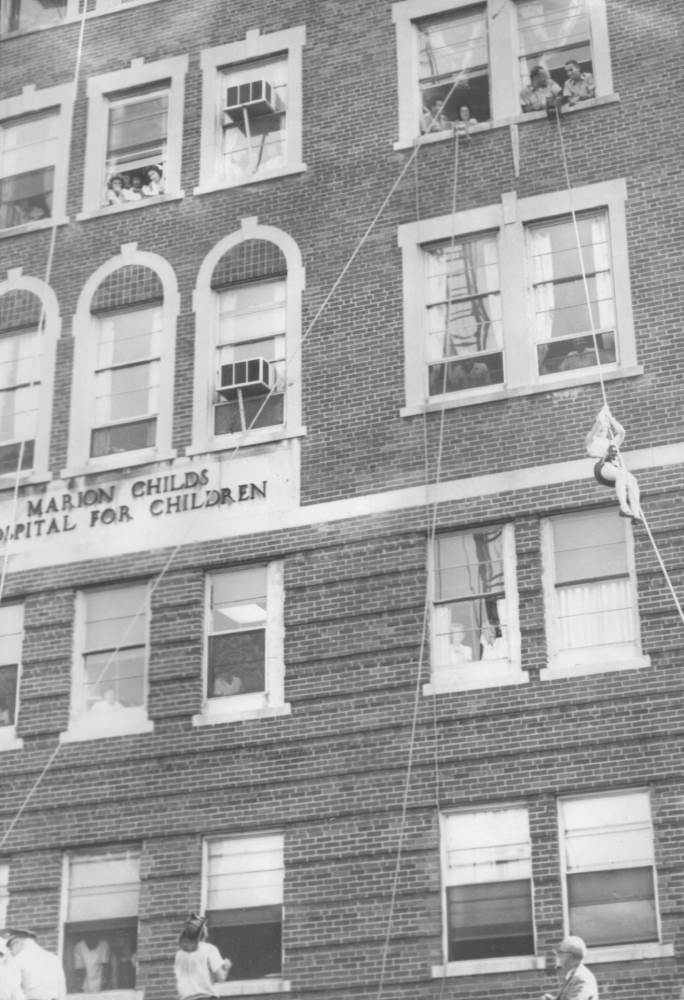 West Jersey Hospital fire rescue drill 1965 — June Peters, student nurse, lowered from fifth floor in stokes basket