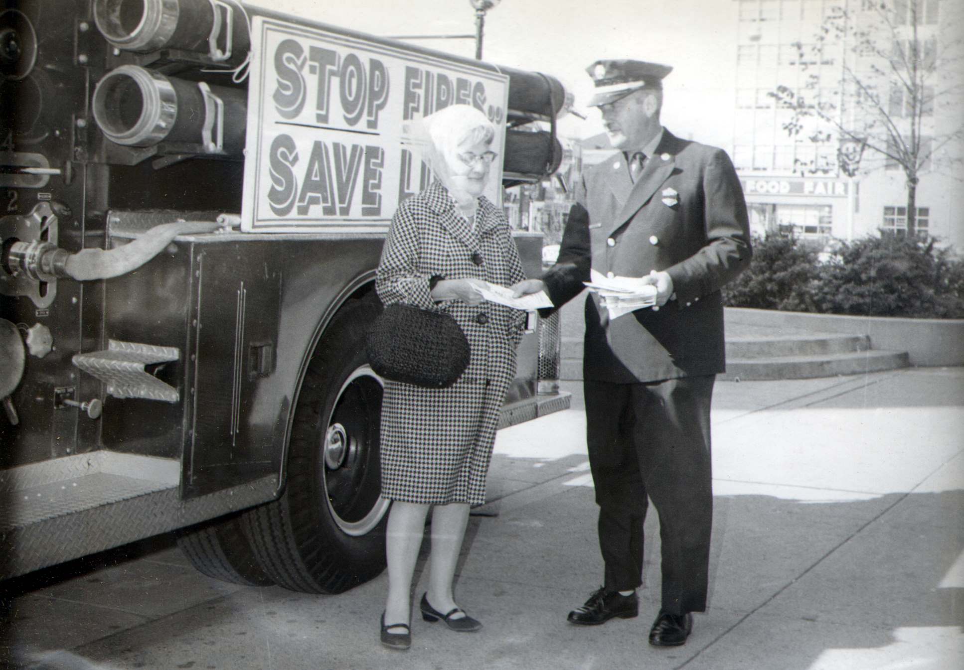Fire prevention literature distribution, 1966, photo 1