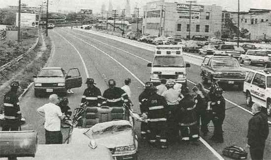 Camden fire fighters and EMS Personnel remove a victim from a car after a bridge collapsed on Admiral Wilson Boulevard