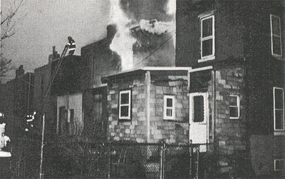 Fire pushes out of 2nd floor at 823 Princeton Street, Feb. 28, 1996