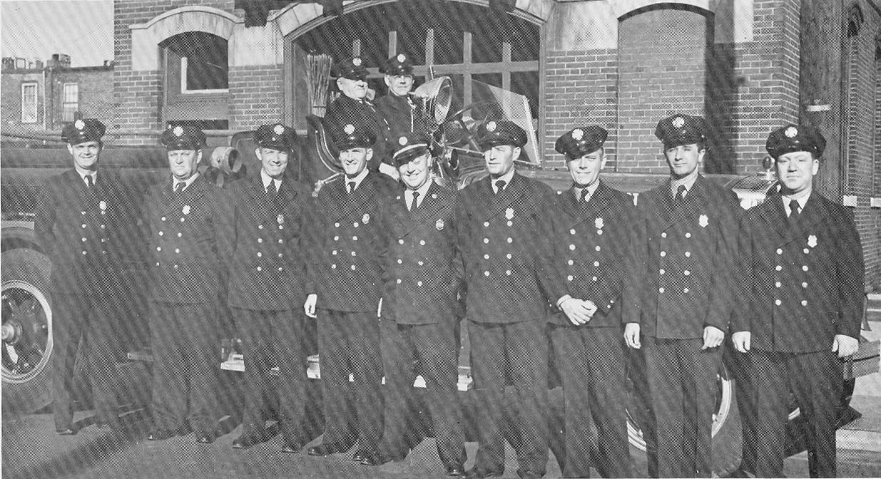 Engine Company 6 group photo circa 1949, showing wagon and pumper at Front and Linden Streets