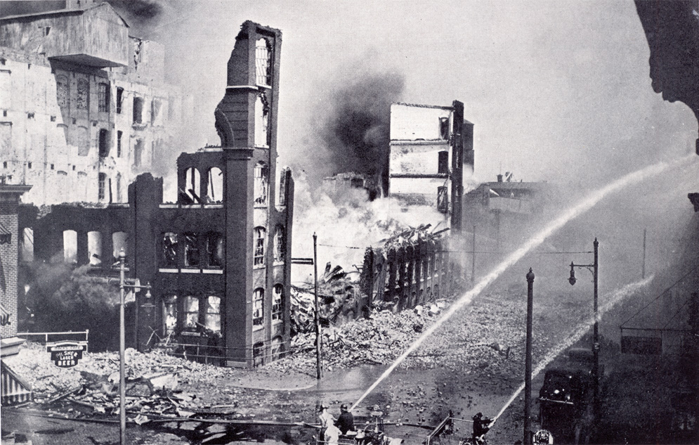 Firemen protecting exposures from the ruins of No. 6 Building; MacDougall's Tavern visible at lower left
