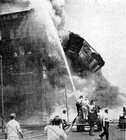 Wall collapse at the Hollingshead fire — newspaper photographer in foreground, Camden, NJ