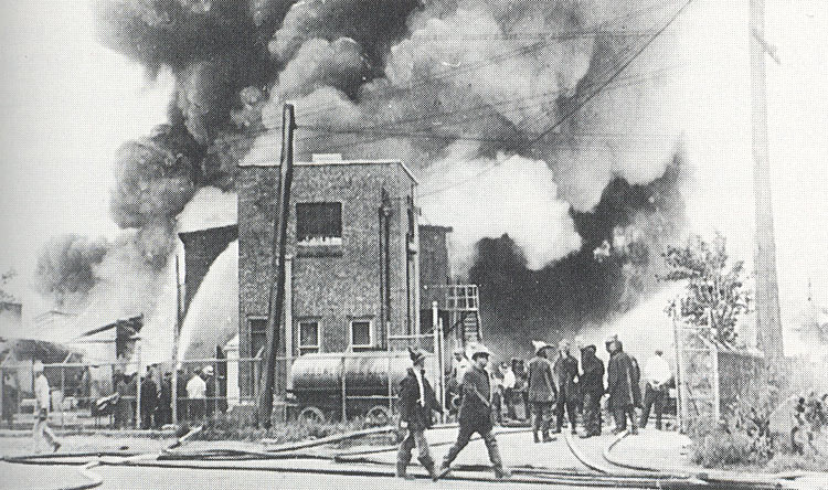 Billowing clouds of toxic smoke rise above the Wetherill Varnish Works near Haddon Avenue and the White Horse Pike, June 27, 1929