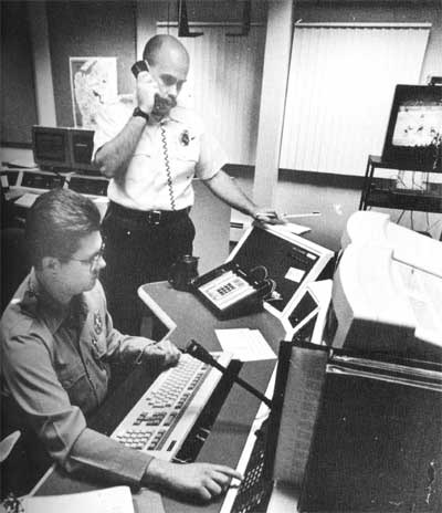 Fire Dispatcher Mike Almony at the radio console and Supervising Fire Dispatcher Alex Hendry in the new Fire & EMS Communications Center for Camden County, Spring 1995
