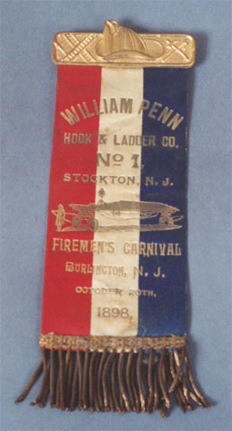 Ribbon worn by William Penn Hook & Ladder Company No. 1 members to a Firemen's Carnival in Burlington, October 20, 1898