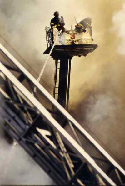 Ladder 3's 1983 Mack 75-foot Tower Ladder at the Comarco fire, June 30, 1990