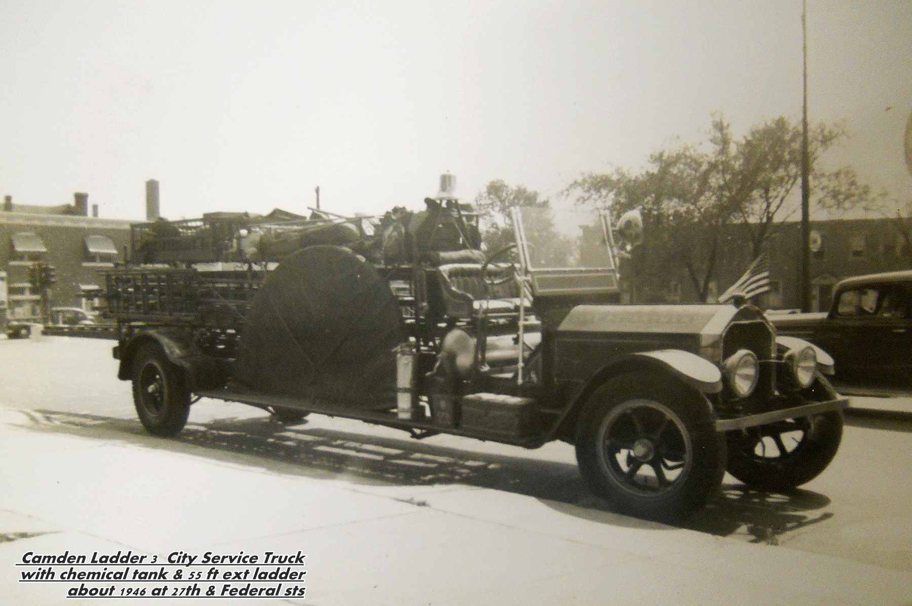 Camden Ladder 3 city service truck with chemical tank and 55 foot extension ladder, about 1946 at 27th Street and Federal Street