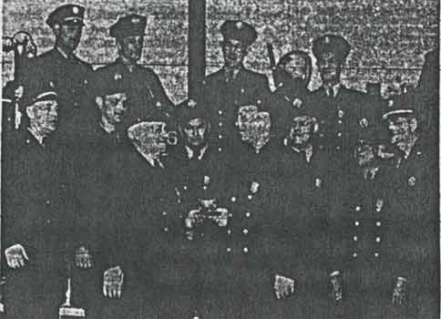 Group photograph of Camden firefighters in dress uniforms at retirement ceremony for John 'Shorty' Prucella