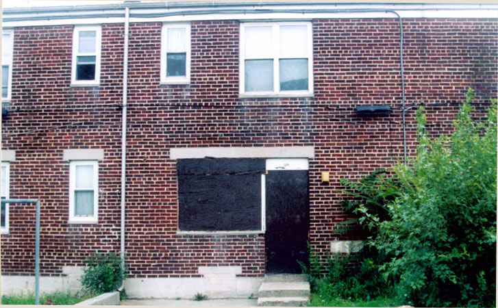 59 Ablett Village, Camden, showing the rear of the dwelling where the coal bin was located, August 2004
